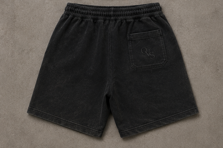 Black t-shirt and shorts set with 'OVERSEE' branding on a gray background